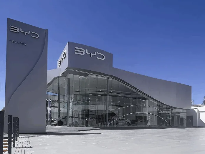 Explore how Trump's 25% auto tariffs impact the fierce Tesla vs BYD EV battle. Will protectionist policies save Musk's company from Chinese competition?